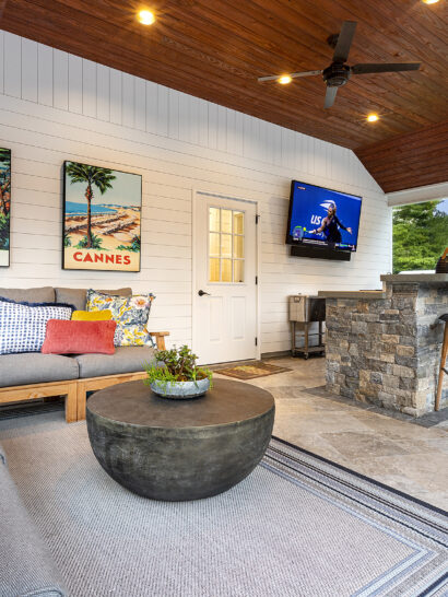 Covered stone patio and outdoor kitchen at Residential Landscape Design-Build Project in Norfolk, MA. Built by Dex By Terra.