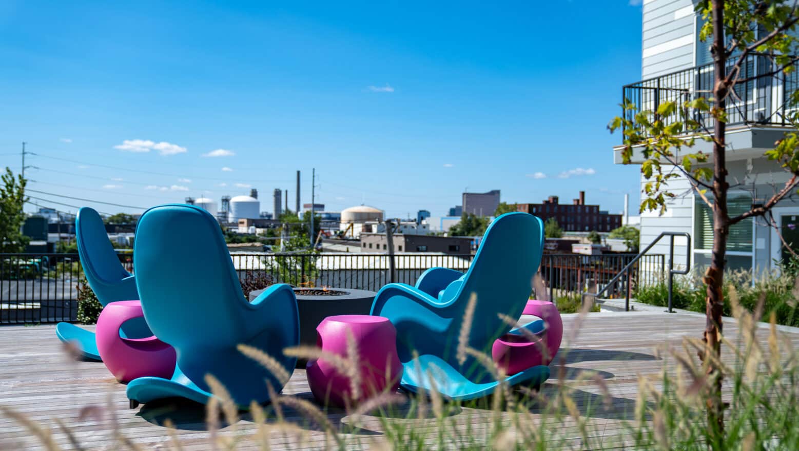 A third floor courtyard seating area, built by Dex by Terra at V2 Apartments, overlooking Chelsea, Massachusetts.