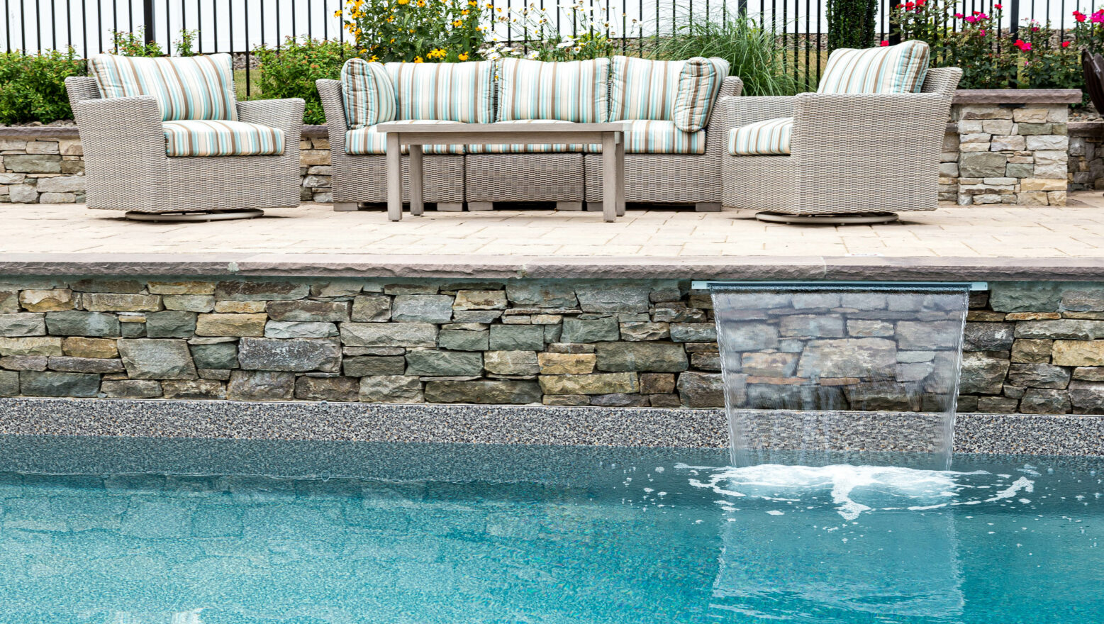 Fountain feature flowing into a pool.