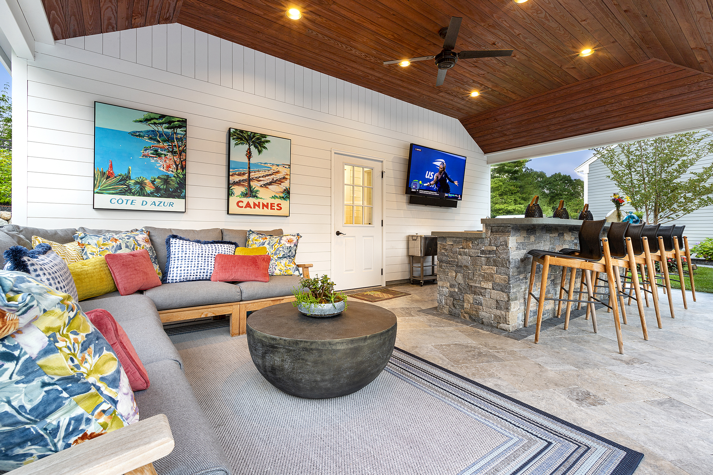 Lounge area patio and outdoor kitchen under the pergola. Dex by Terra Landscape Design & Build Project in Norfolk, MA.