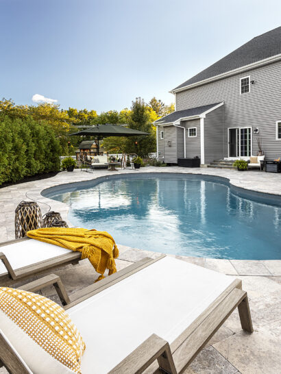 Lounge chairs by the pool. Dex by Terra Residential Landscape Design & Build Project in Shrewsbury, Massachusetts