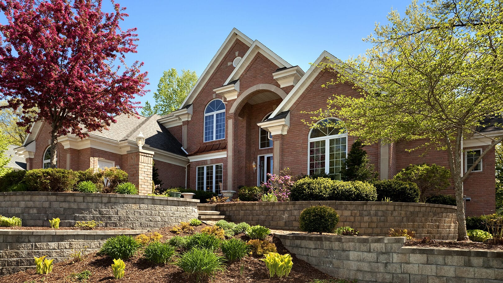 Mansion Home Exterior Design; Terraced Paved Landscape, Colorful Spring Foliage