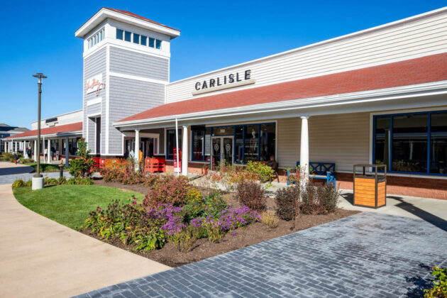 Flower bed with landscaping and concrete walkways at the Wrentham Outlets. Dex by Terra Hardscape and Landscape project.
