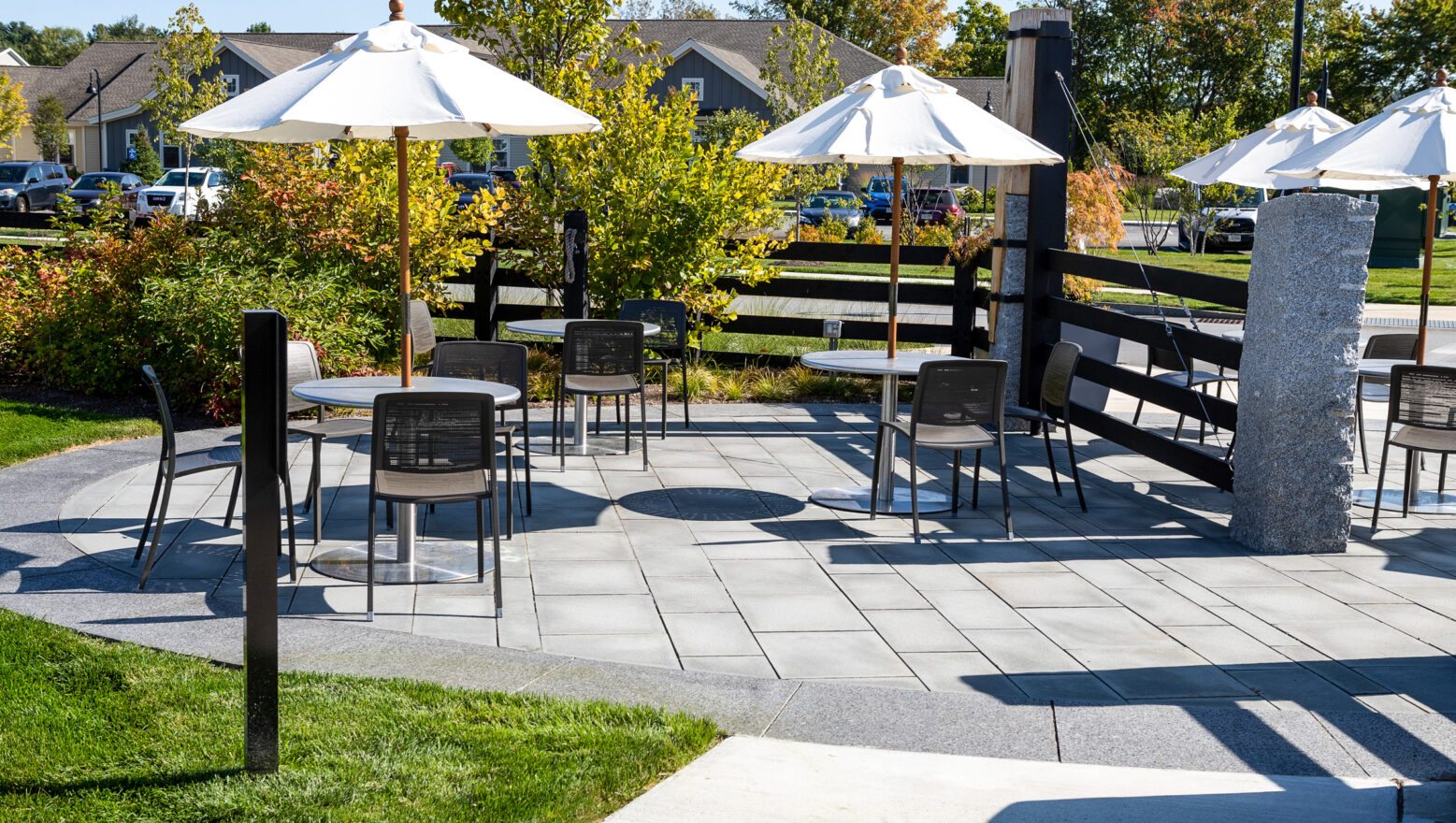 Natural Stone Paver Patio with tables and chairs. Dex by Terra commercial masonry & hardscape project.