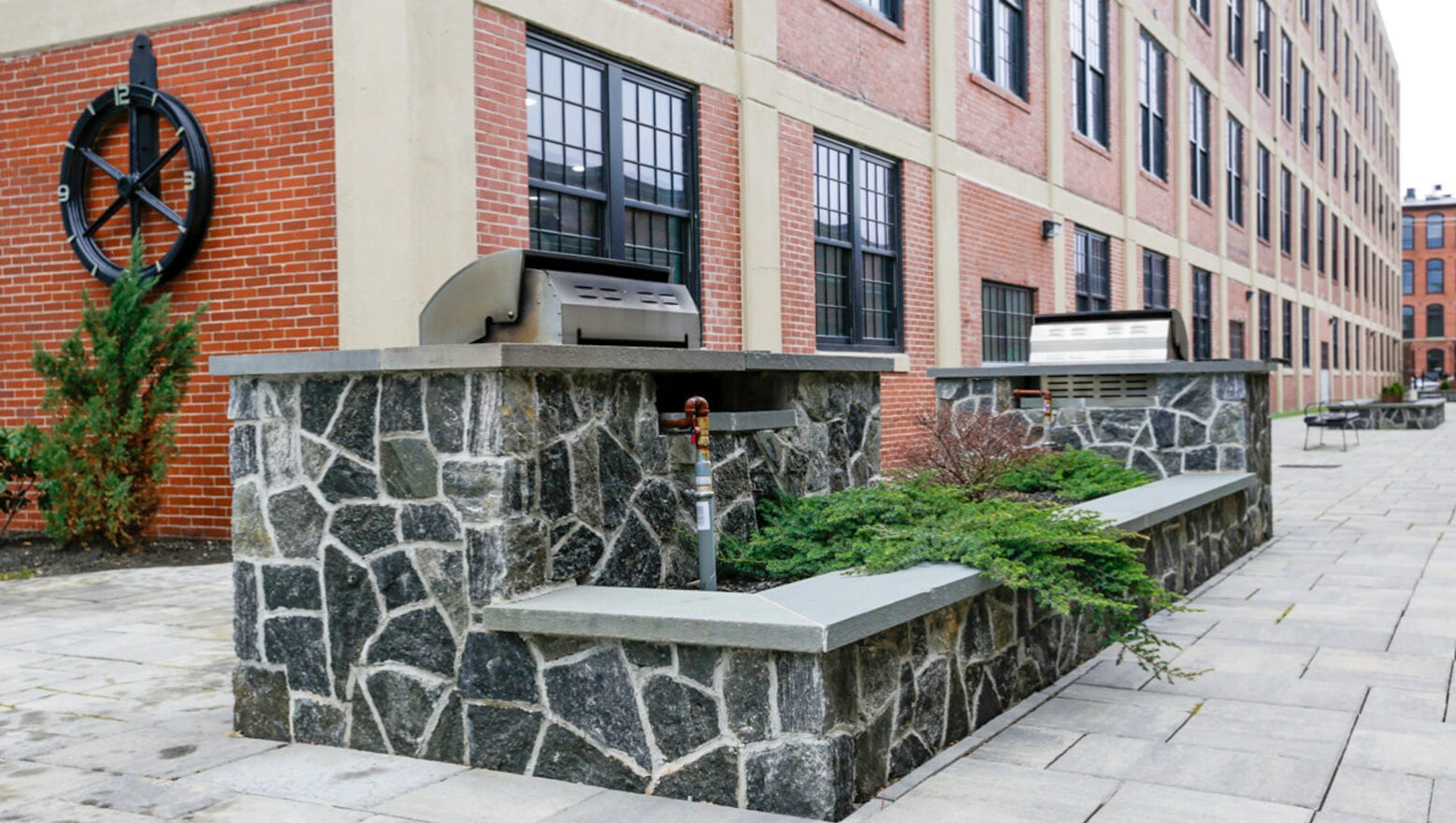 Stone Grill Station at converted warehouse. Dex by Terra Commercial brick restoration, repointing, & masonry project.